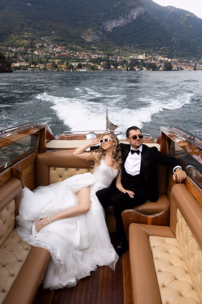 Wedding in Italy, Lake Como. Young couple sailing on Lake Como.