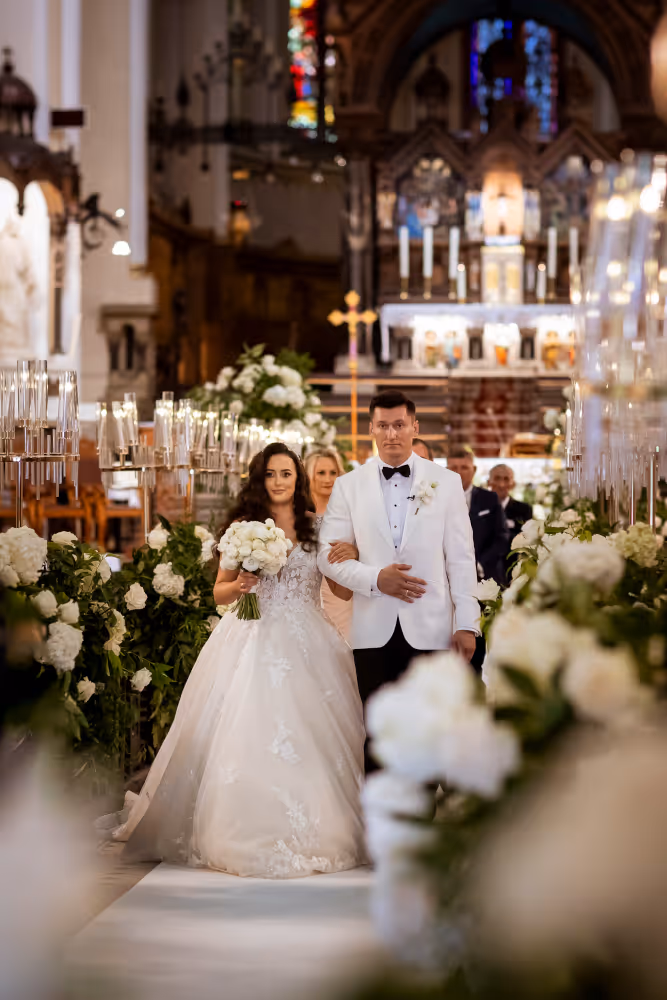 Wedding in Poland, Śląsk. Young couple leaving the church after the wedding ceremony.