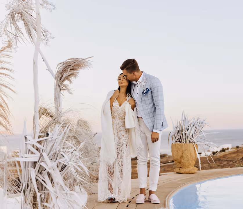 Wedding in Greece, Mykonos. Young couple embracing each other.